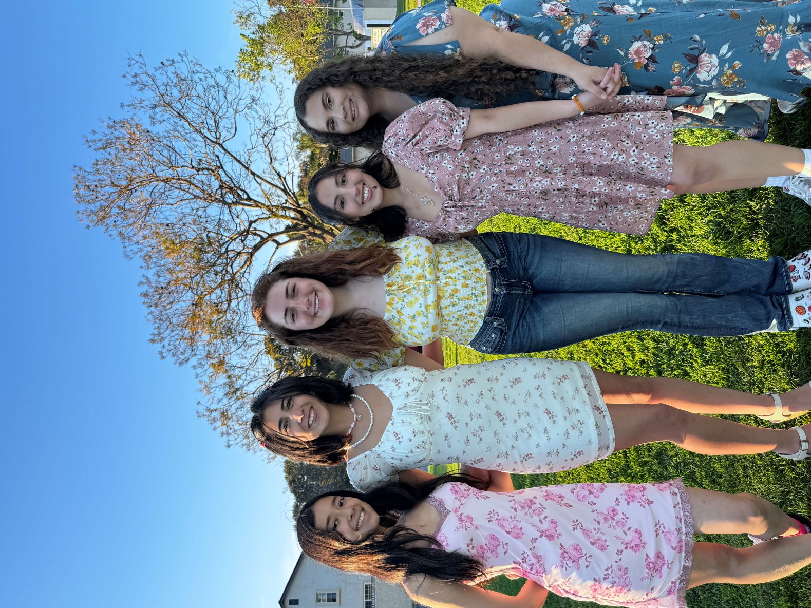 A few ADP members together in floral dresses